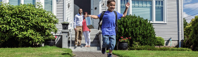 child walking out of the home with parents watching from behind. Rental insurance is important for homeowners who want to protect their homes. 